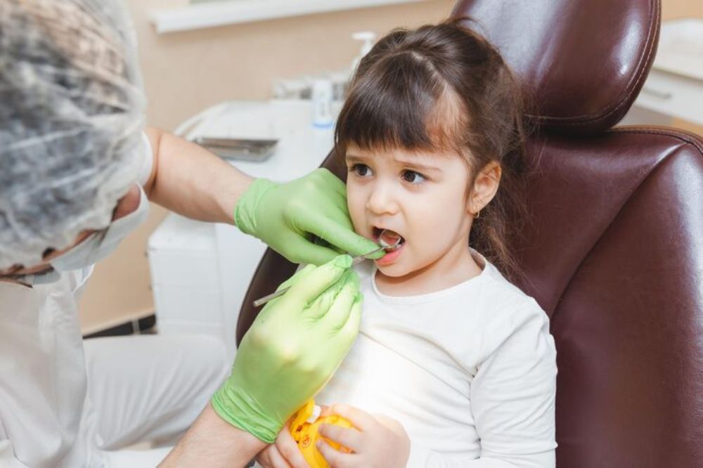 child receiving preventive dental care during a dental checkup to help prevent cavities and tooth decay
