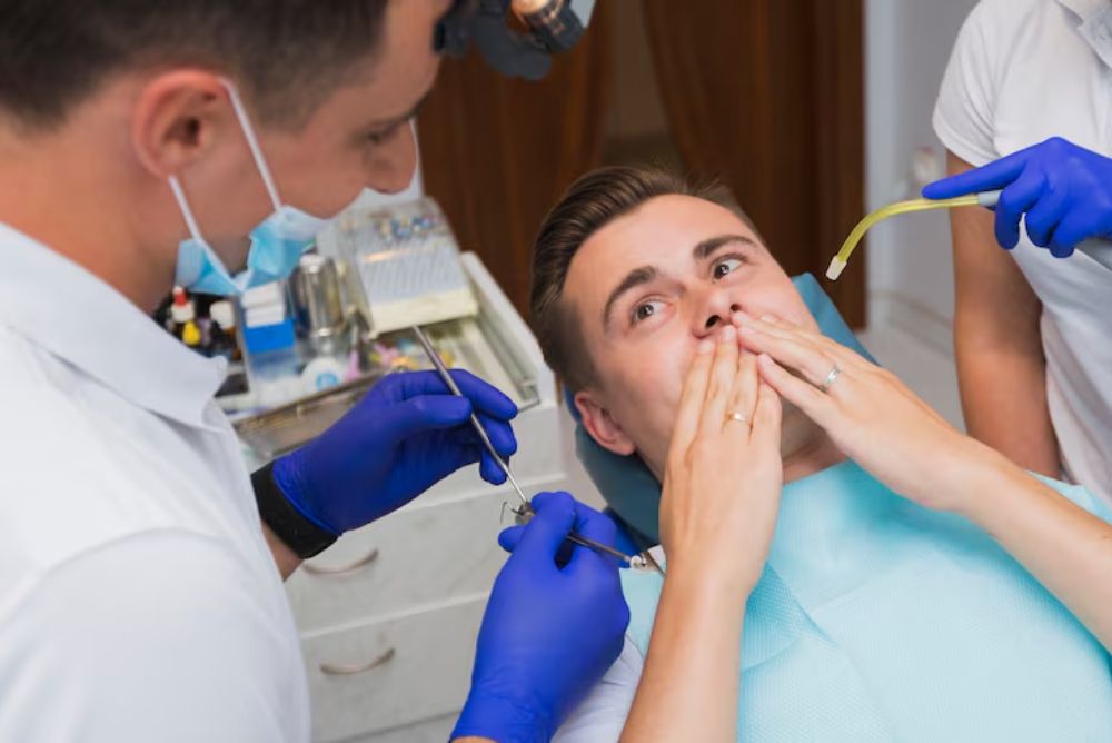 dentist performing dental treatment on a patient with a damaged tooth